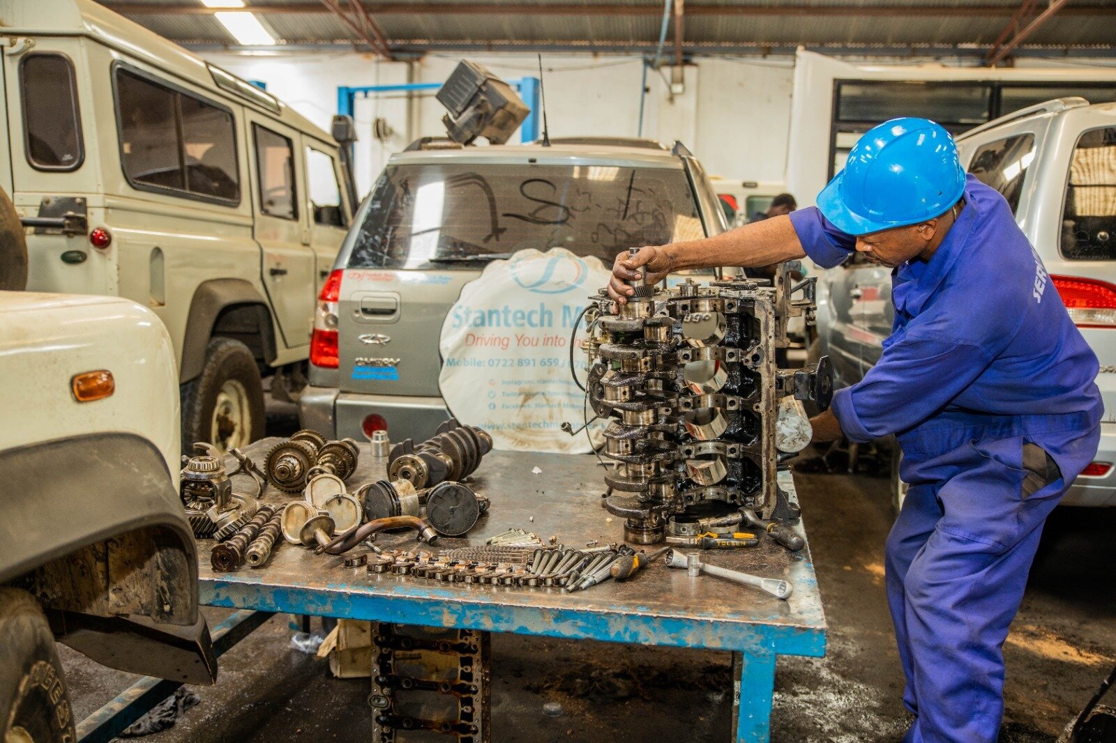 Technician fixing engine